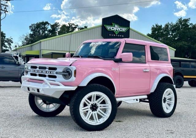 image of a custom Bronco in baby pink with white accents