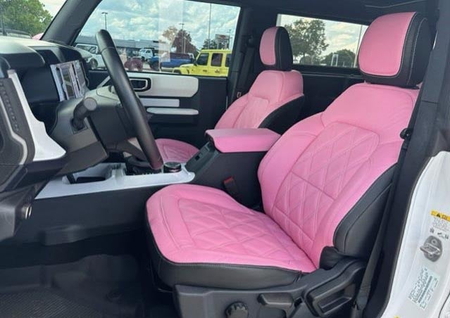 image of a custom Bronco in baby pink with white accents