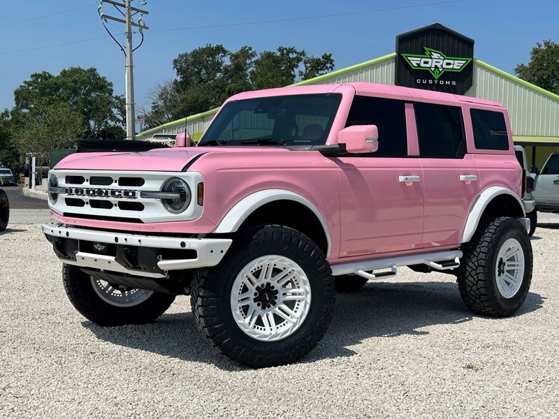 Pink ford bronco passenger side view 2