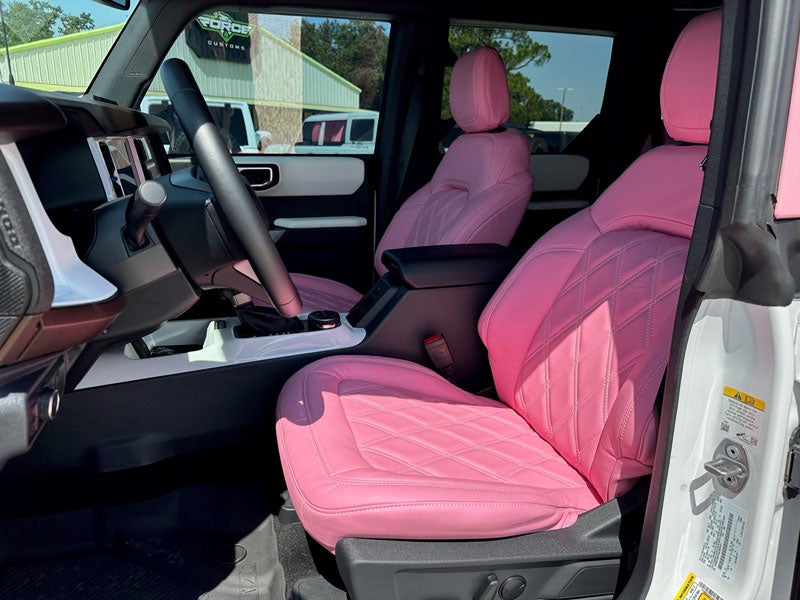 Pink ford bronco passenger side view front seat