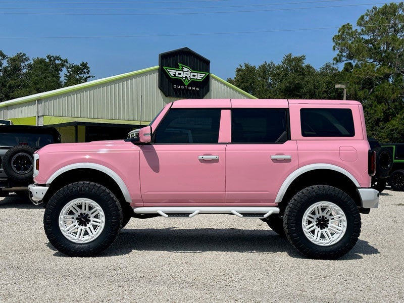 Pink ford bronco passenger side view side