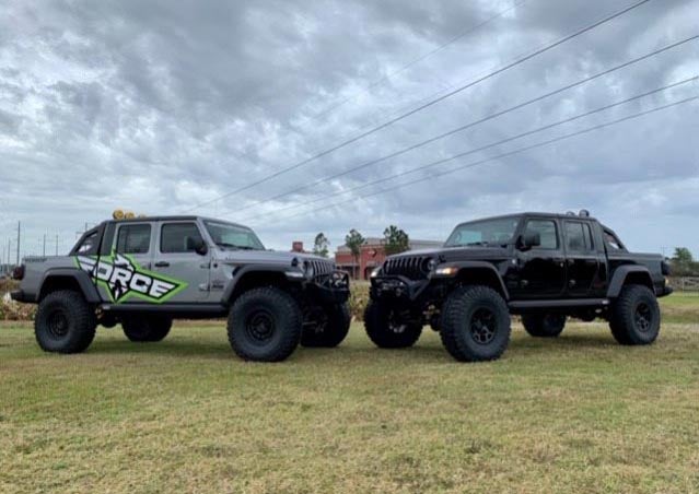 image of 2 custom trucks